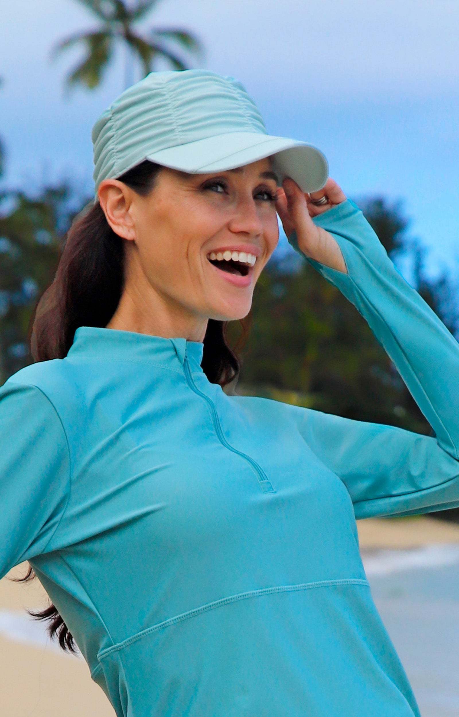 woman in ruched sun cap|dewdrop
