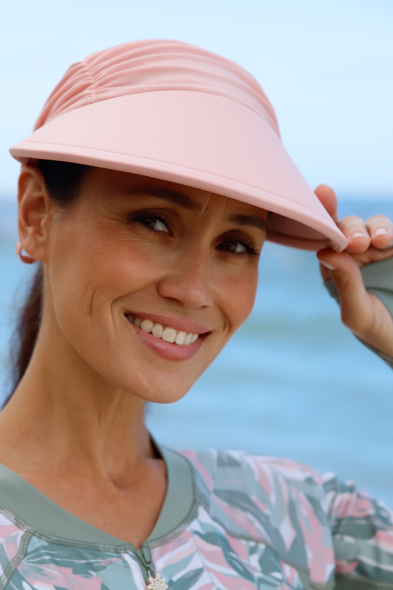 woman in dusty pink swim visor|dusty-pink