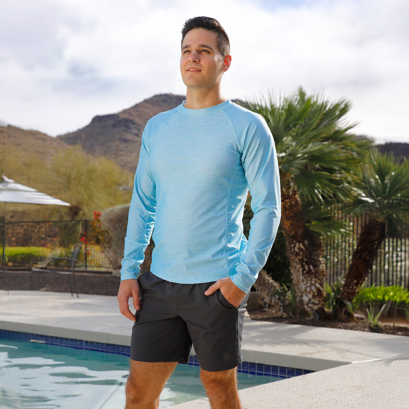 man by the pool wearing mens long sleeve crew sun & swim shirt|aquamarine-jaspe