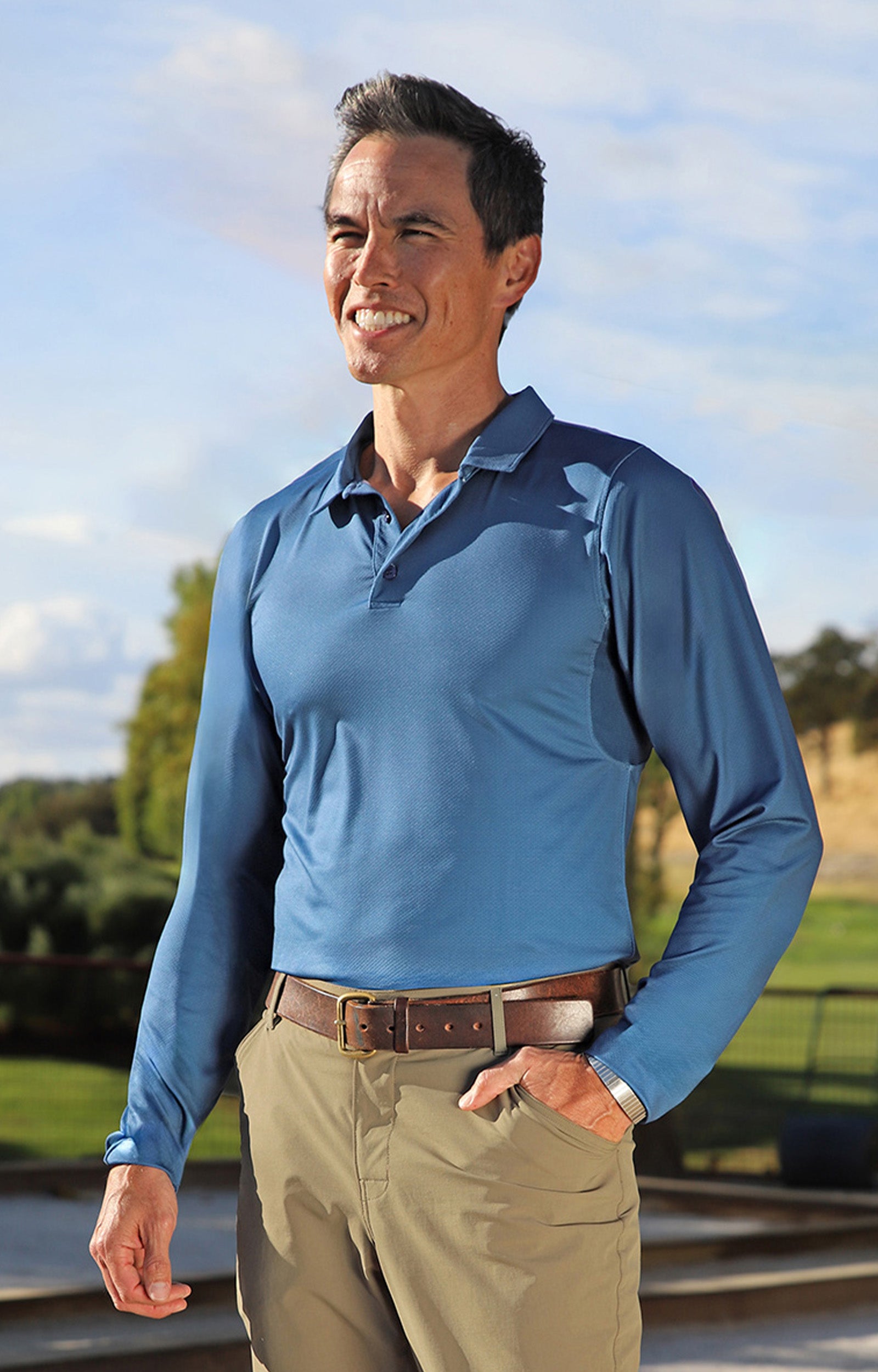 man in long sleeve performance polo in blue links|blue-links