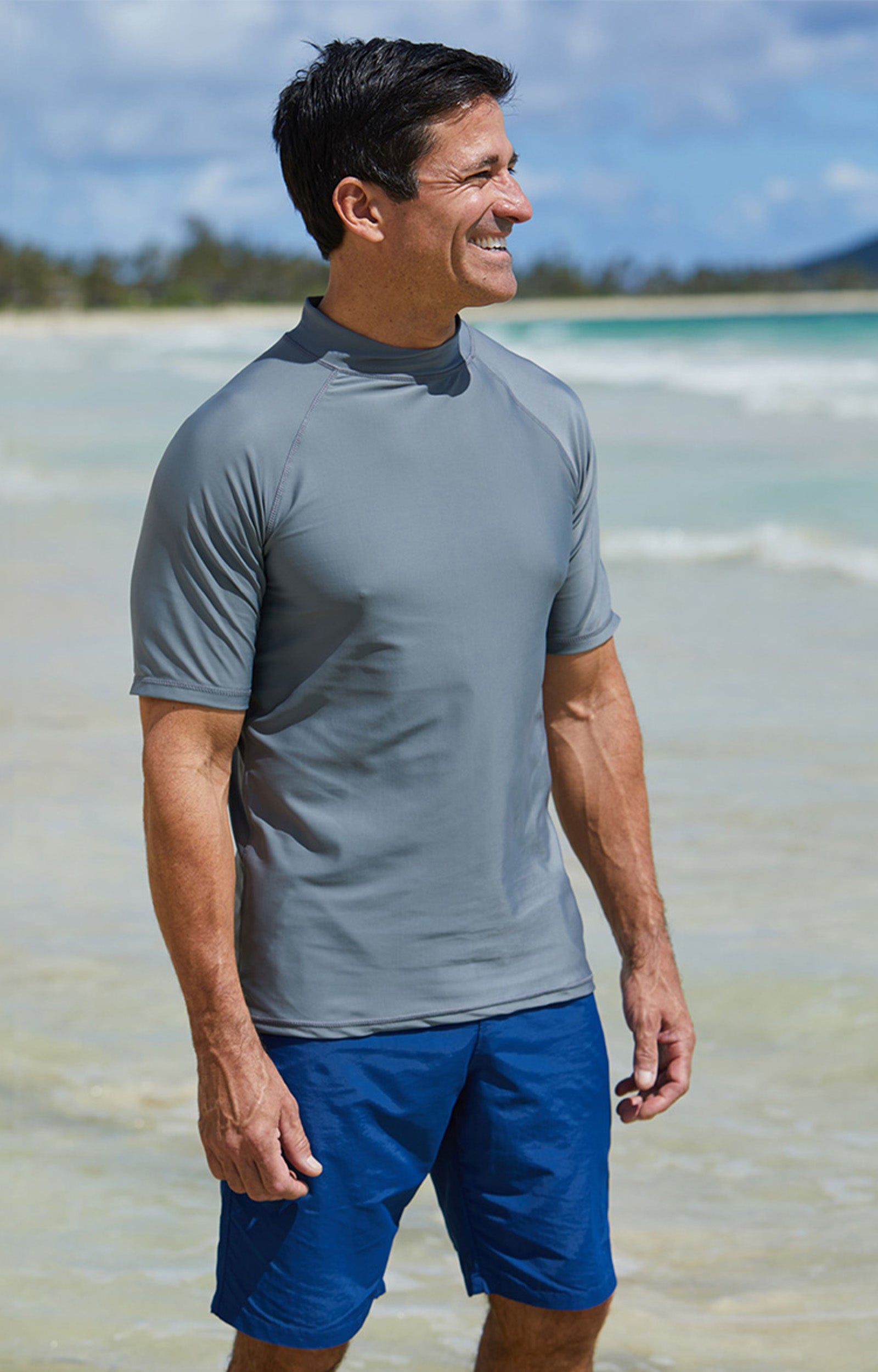 Man in UV Skinz's men's classic trunks in dark navy|dark-navy