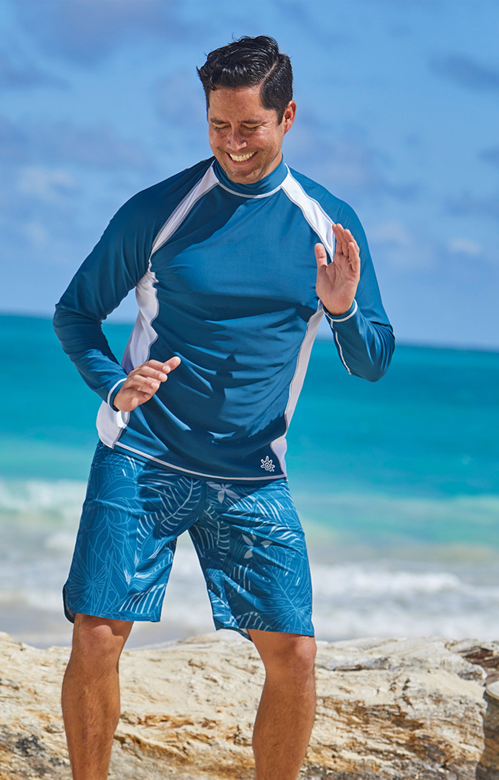 Man wearing UV Skinz's men's long sleeve active swim shirt in midnight white|midnight-white