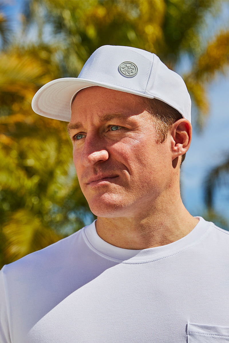 Man in UV Skinz's men's snapback hat in white|white