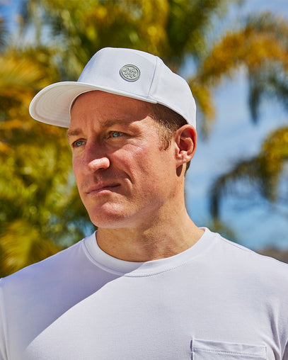 Man in UV Skinz's men's snapback hat in white|white