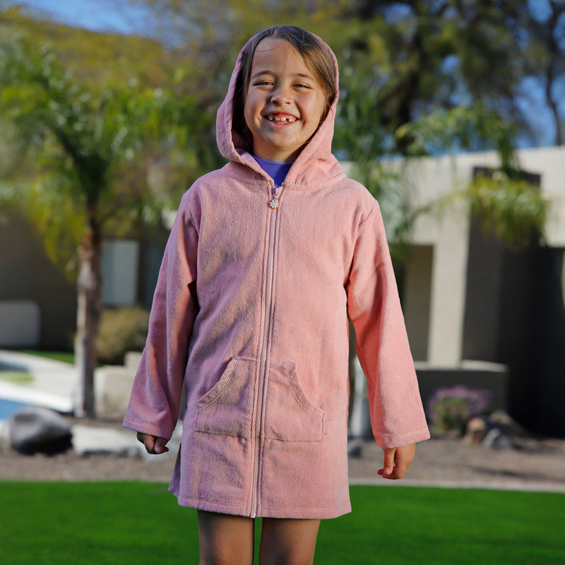 girl having fun in kids hooded terry beach cover up|dusty-pink