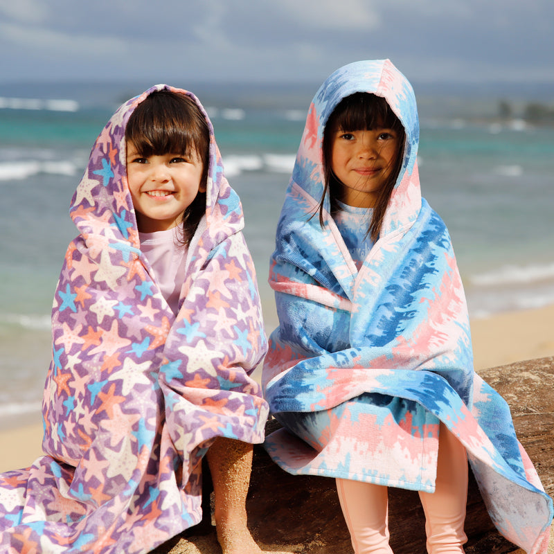 girls sitting on beach in kids hooded beach towel|sandcastle-dreams