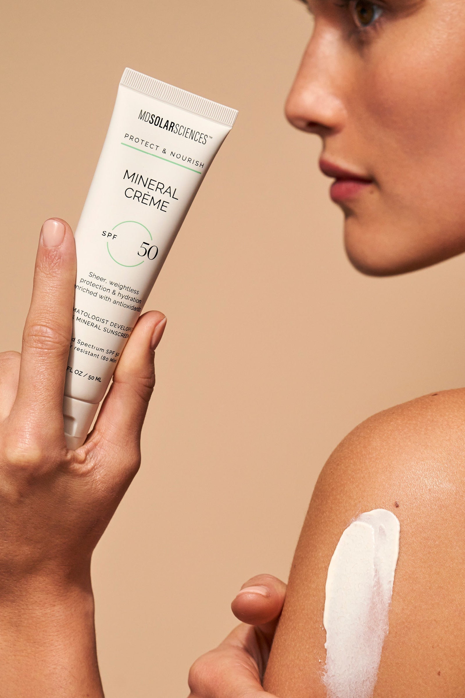 Woman wearing MDSolarSciences Mineral Creme - Face & Body Sunscreen - SPF 50+