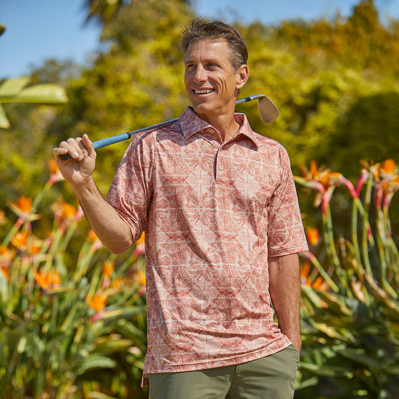 Man golfing in UV Skinz's Men's Short Sleeve Polo in Canyon Stained Glass|canyon-stained-glass