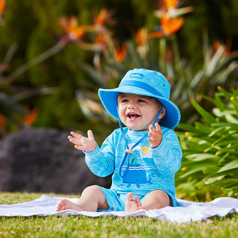 Baby boy in UV Skinz's baby boy's swim hat in aqua jaspe|aqua-jaspe