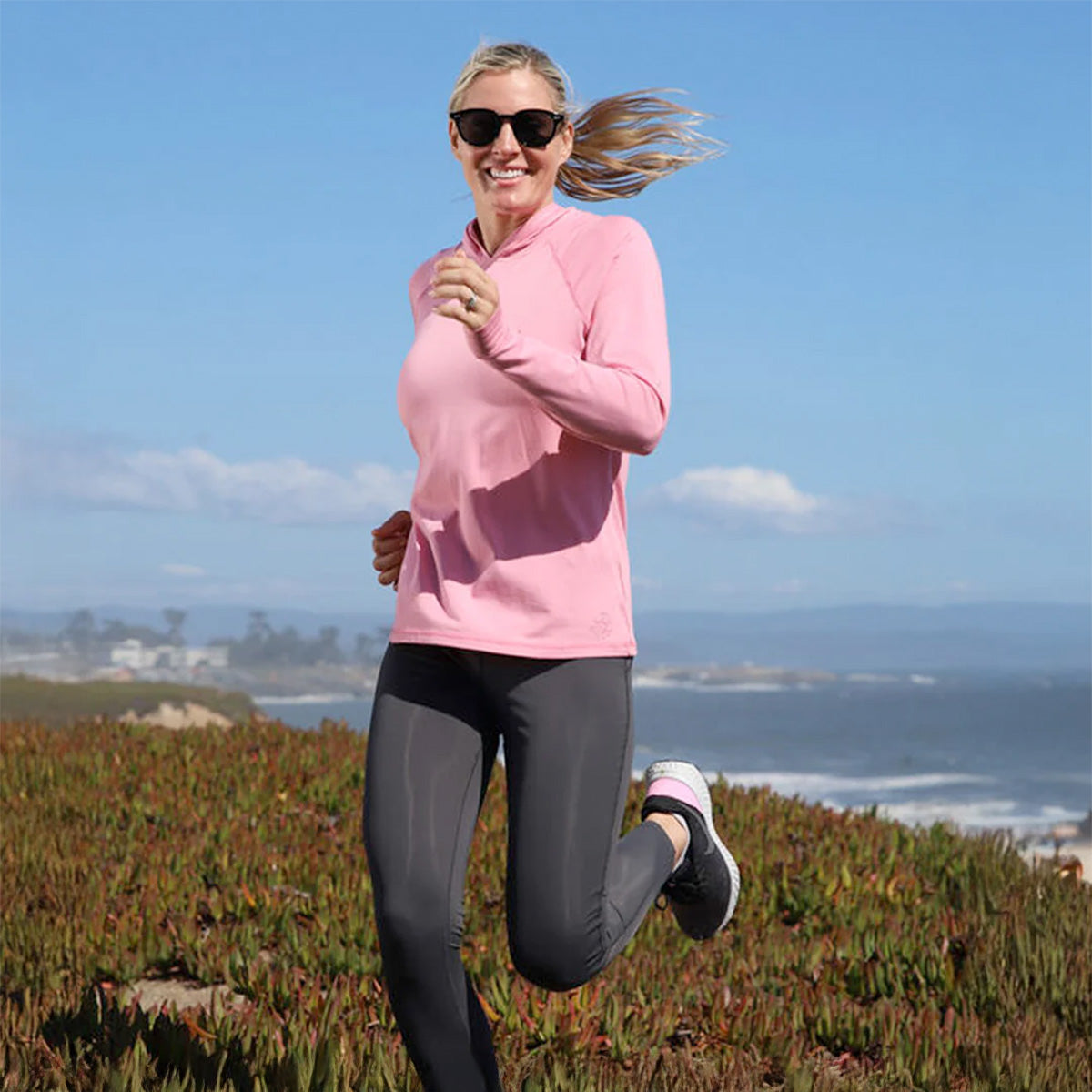 Woman in UV Skinz activewear during outdoor fitness