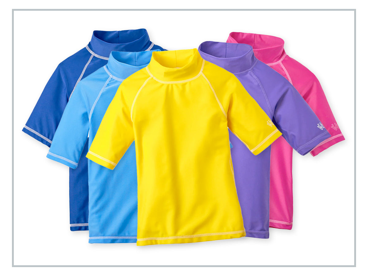 Children playing outdoors in colorful UV Skinz clothing