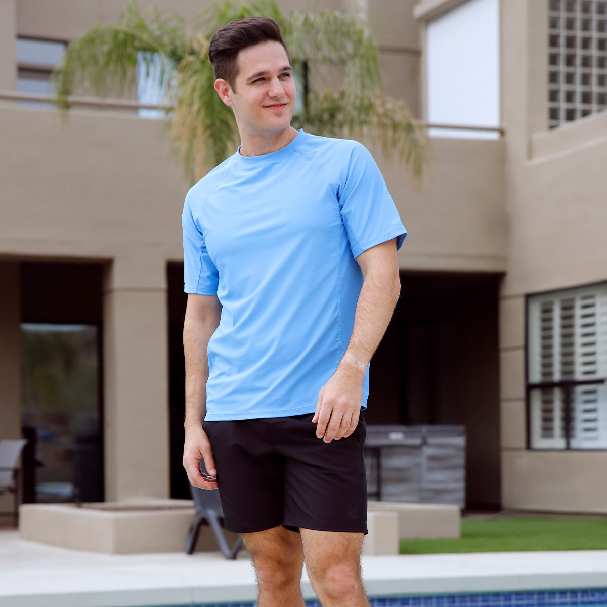 Man in UV Skinz swimwear engaged in water activities