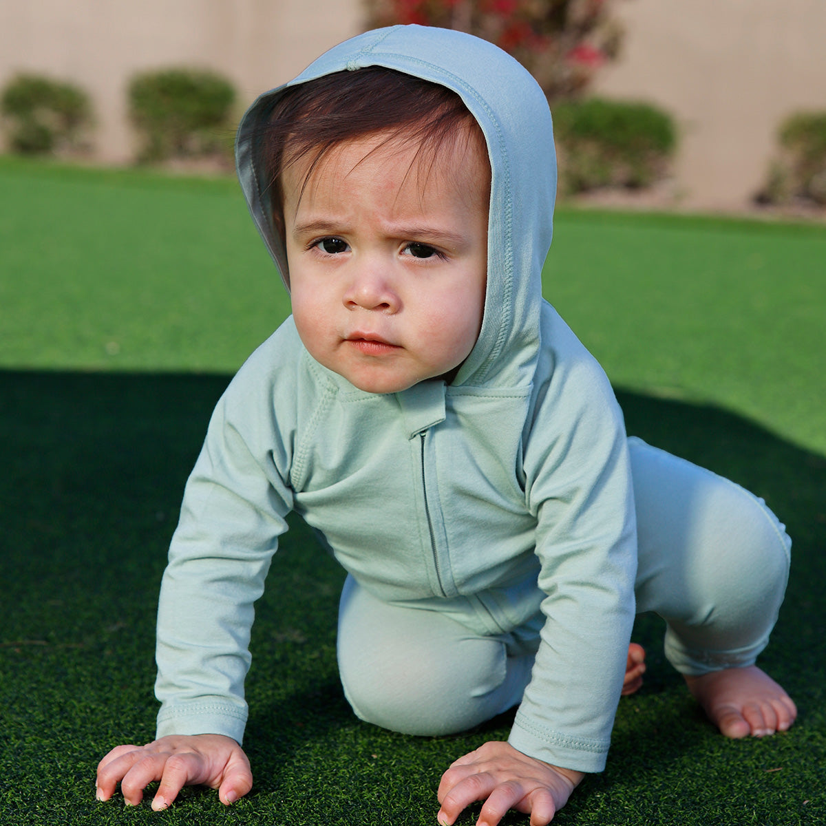 Snuggly baby wearing chemical-free UV Skinz essentials