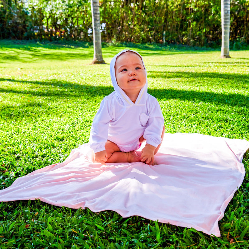 Baby on a Blanket in the Baby Girl's Hooded Sunzie in White|white