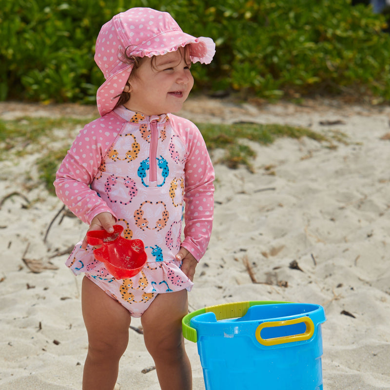 Little Girl in UV Skinz's Baby Girl's Long Sleeve Ruffled Swimsuit in Pink Leopard Spots|pink-leopard-spots