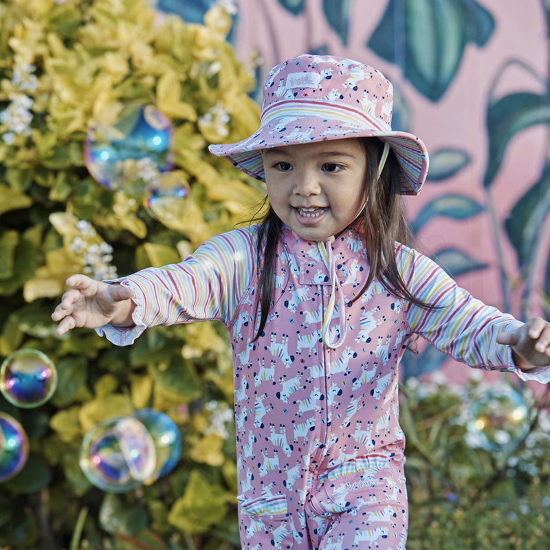 Little girl in the baby girl's swim hat in rainbow zebra|rainbow-zebra