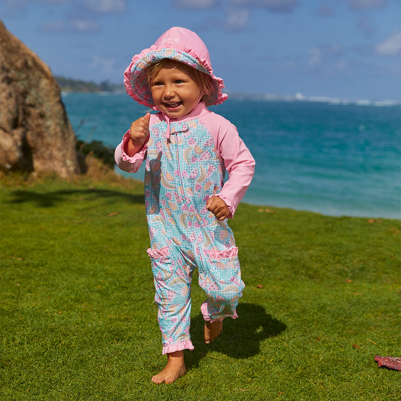 Baby girl in UV Skinz's baby girls long-sleeve swimsuit in fruit fiesta|fruit-fiesta