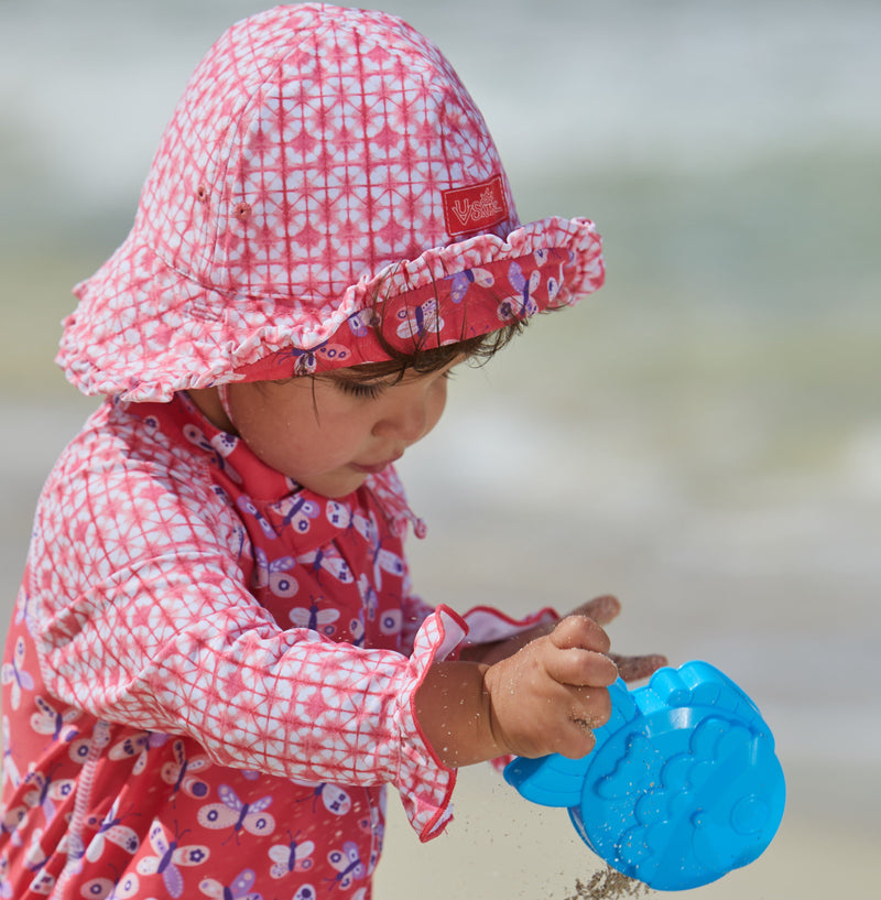 Little Girl in UV Skinz's Baby Girl's Reversible Sun Hat in Butterflies|butterflies