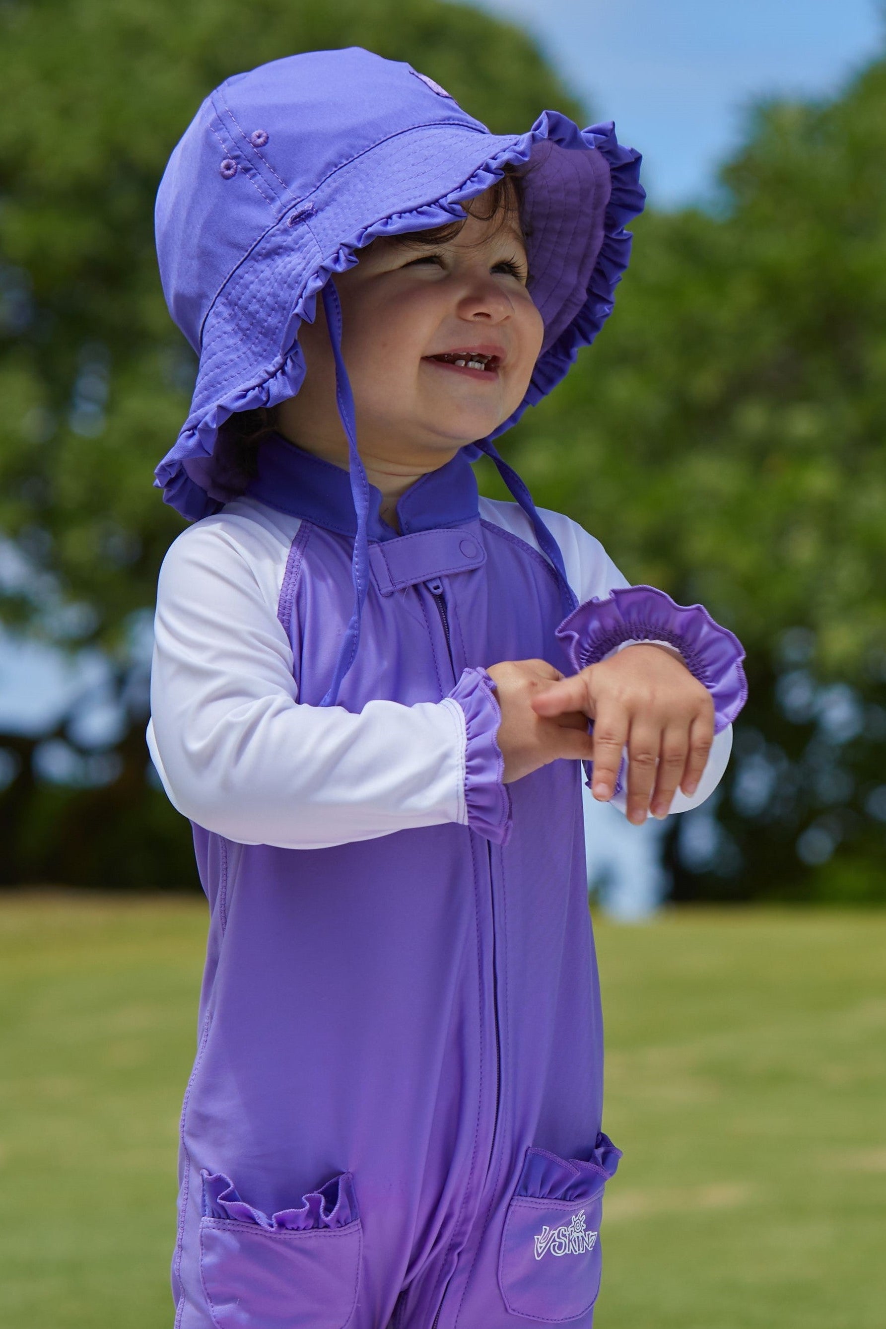 Baby girl in UV Skinz's baby girl's reversible sun hat in purple misty purple|purple-misty-purple