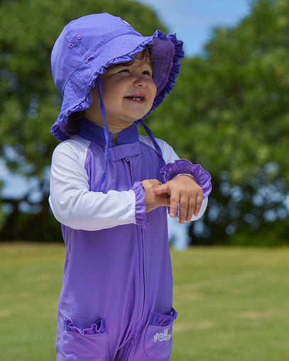 Baby girl in UV Skinz's baby girl's reversible sun hat in purple misty purple|purple-misty-purple