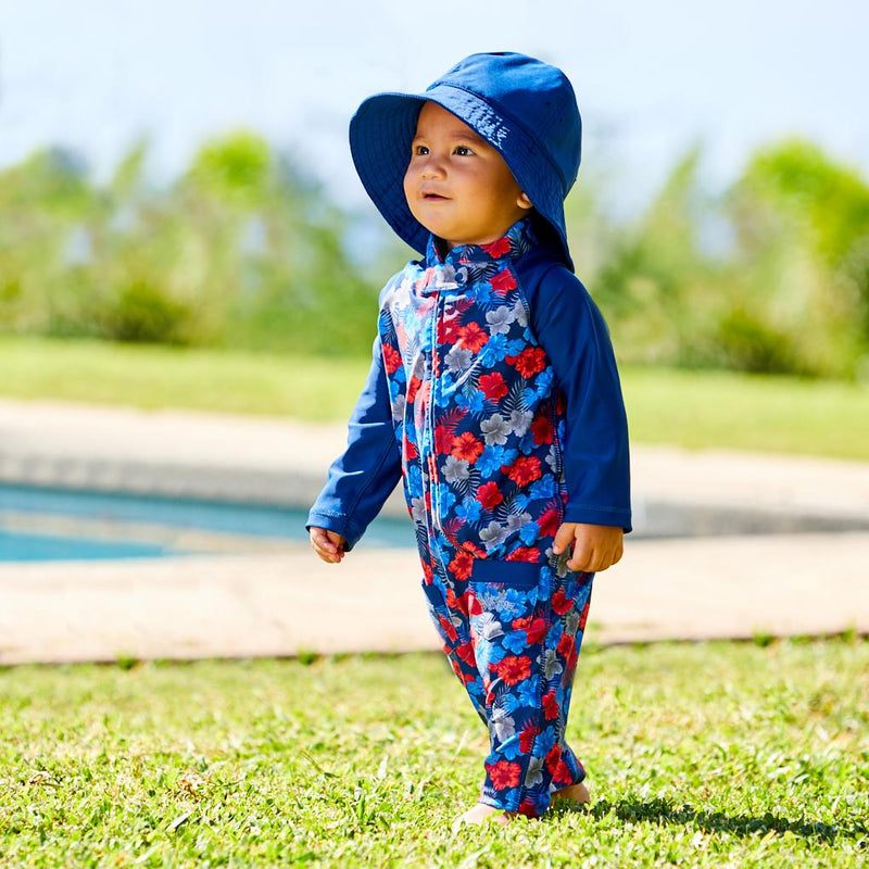 Baby boy in UV Skinz's baby boy's one-piece swimsuit in americana hibiscus rated UPF 50+|americana-hibiscus