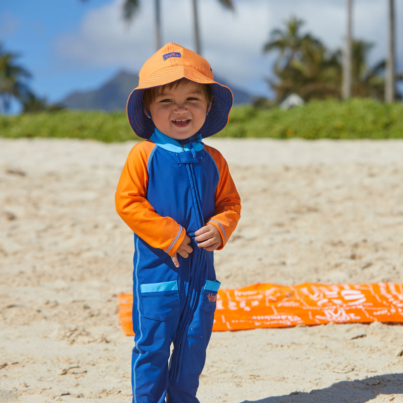 Baby boy in UV Skinz's  baby boy's long-sleeve swimsuit in navy blue orange|navy-blue-orange