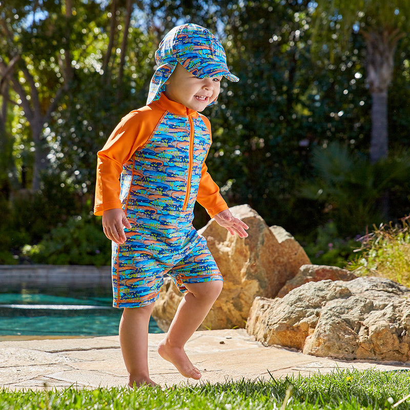 Little boy in UV Skinz's baby boy's UPF swimsuit|surfing-sharks