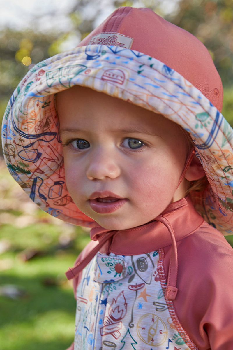 Baby boy in UV Skinz's baby boy's sun hat in campfire doodle|campfire-doodle