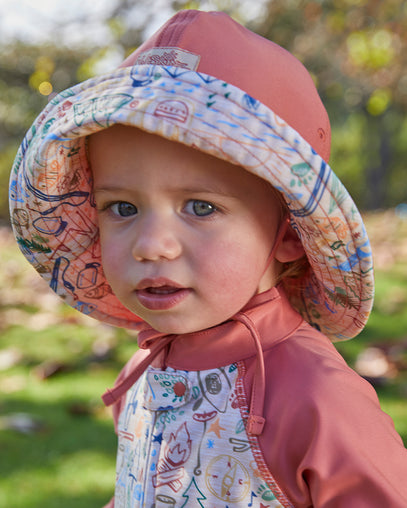 Baby boy in UV Skinz's baby boy's sun hat in campfire doodle|campfire-doodle