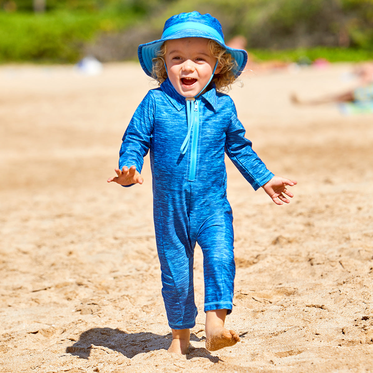 Baby boy in baby boy's swim hat in royal palm tree|royal-palm-tree