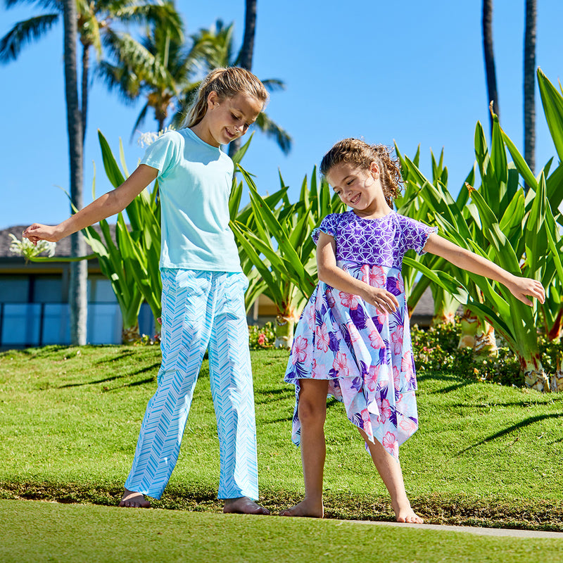 Girls playing in UV Skinz's UPF t-shirts|beach-glass