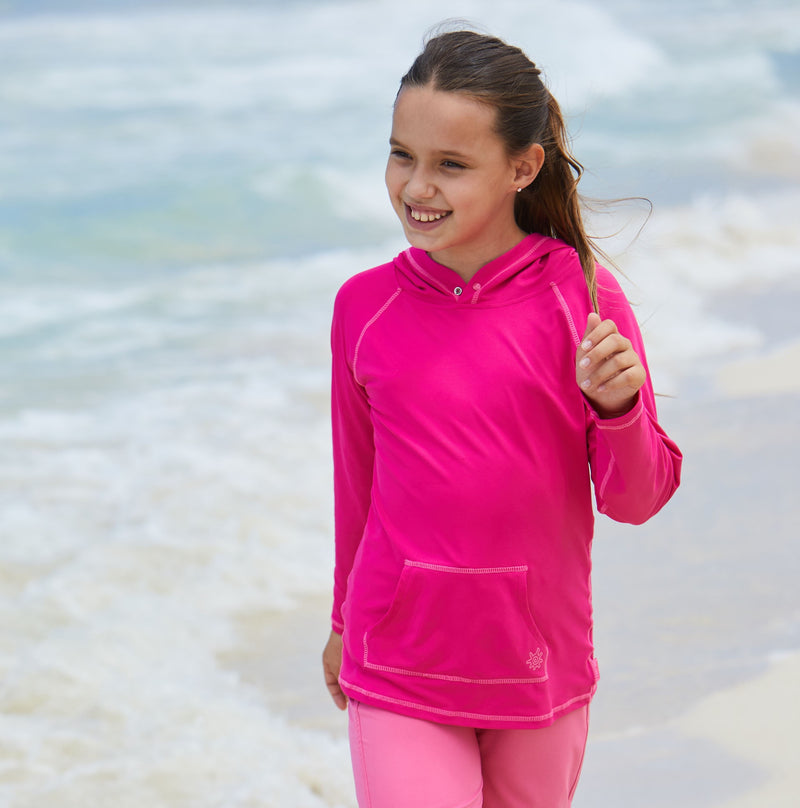 Girl in UV Skinz's girls pullover hoodie in hot pink|hot-pink