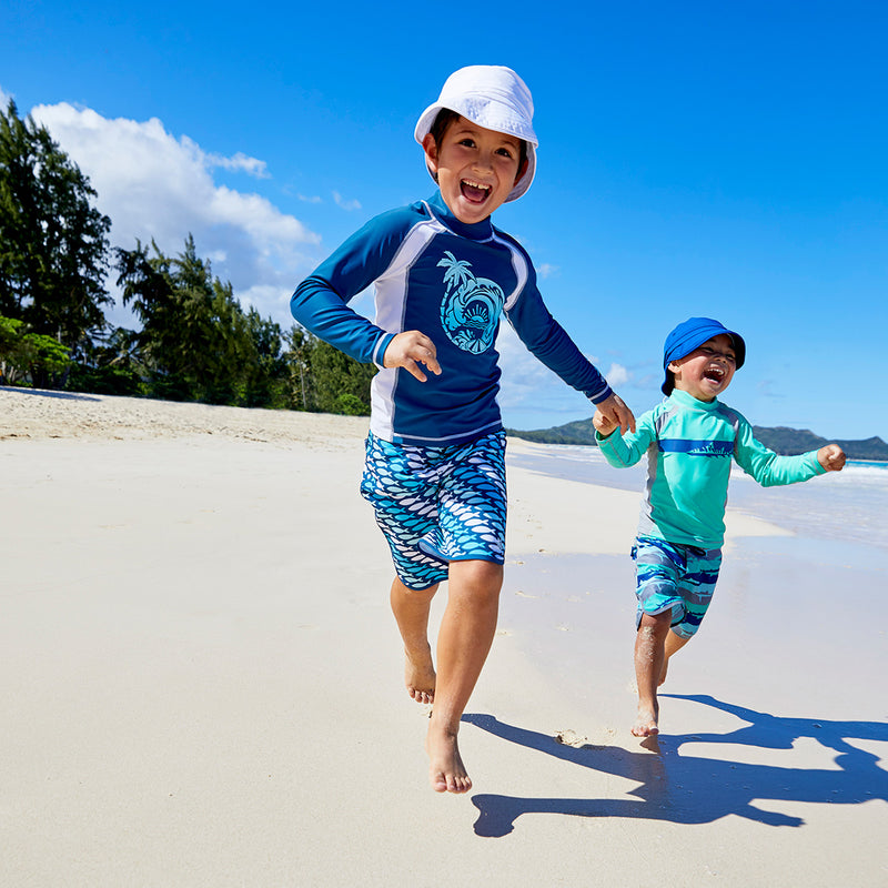 Little boys wearing UV Skinz's Boy's long sleeve active swim shirts in white octopus stripe|white-octopus-stripe