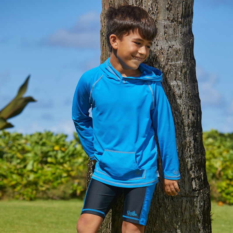 Young boy in UV Skinz's boy's pullover hoodie in royal|royal