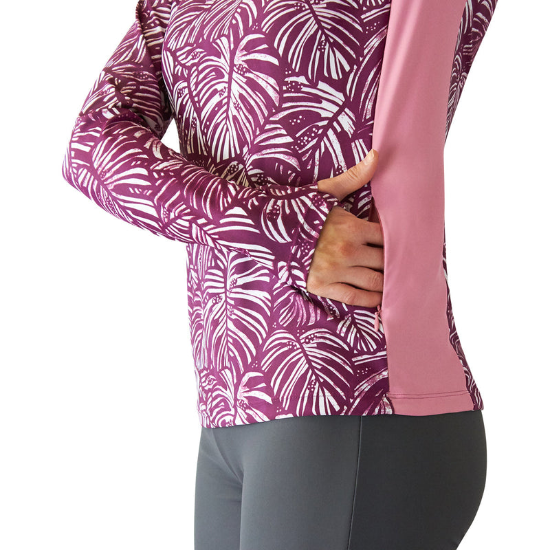 close up of the thumb holes on the women's long sleeve swim shirt with UPF in wine botanical|wine-botanical