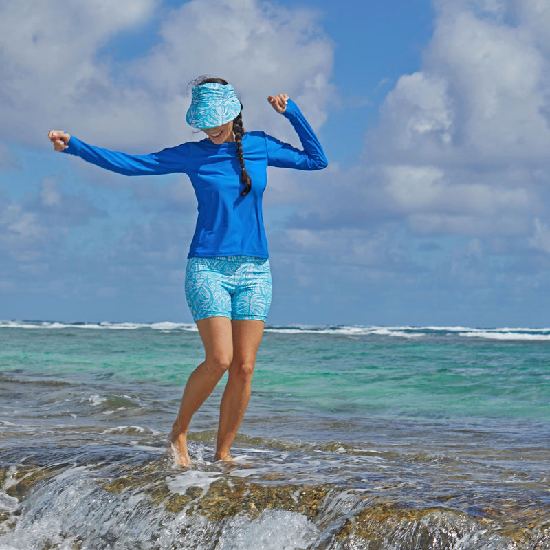 Woman in the Ocean in the Women's Active Swim Shorts in Scuba Blue Botanical|scuba-blue-botanical