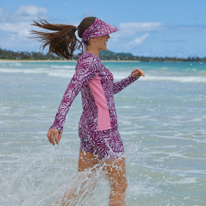 Woman Splashing in the Water in the Women's Active Swim Shorts in Wine Botanical|wine-botanical