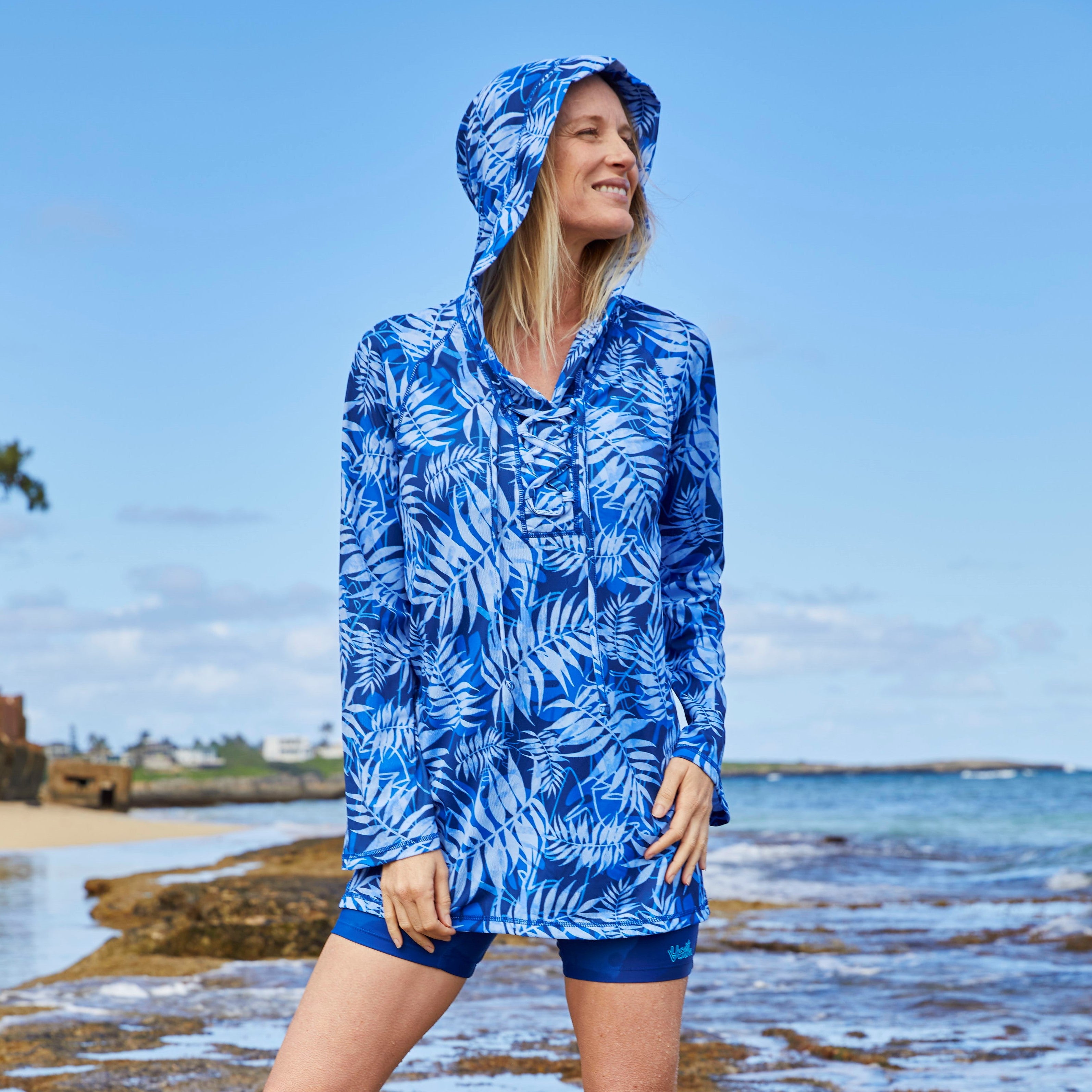 Woman on the Beach in the Women's Hooded Beach Cover Up in Navy Blue Palms|navy-blue-palms