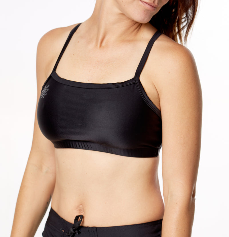 woman wearing UV Skinz's swim bra in black|black