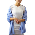 Woman in UV Skinz's women's sun shawl in blue mist|blue-mist