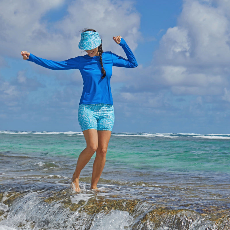 Woman in UV Skinz's swim visor|scuba-blue-botanical