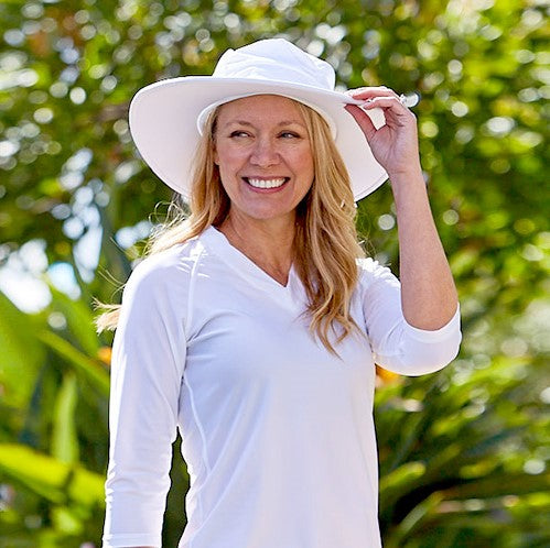 Woman in UV Skinz's women's swim hat in white|white
