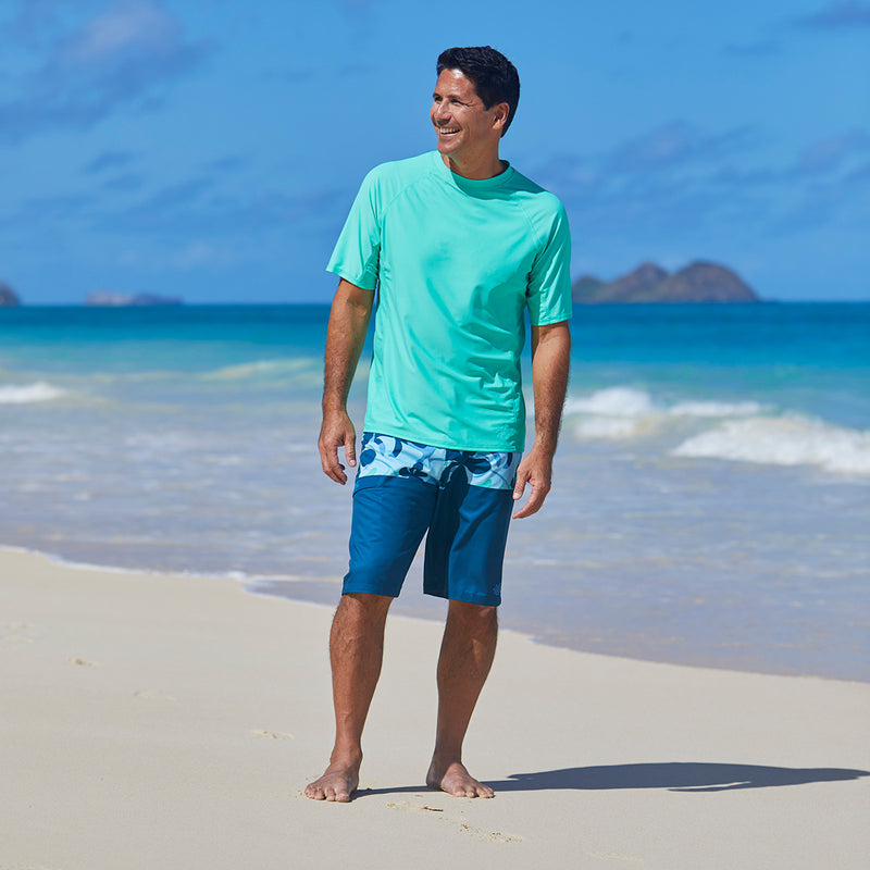 Man wearing UV Skinz's mint short sleeve swim shirt|mint