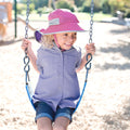 Little girl in UV Skinz's kids play sun hat in blossom|blossom