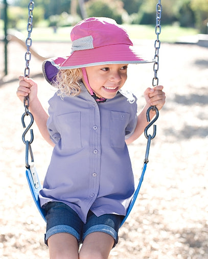 Little girl in UV Skinz's kids play sun hat in blossom|blossom