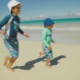 Little boys playing in UV Skinz's boy's long sleeve active swim shirts