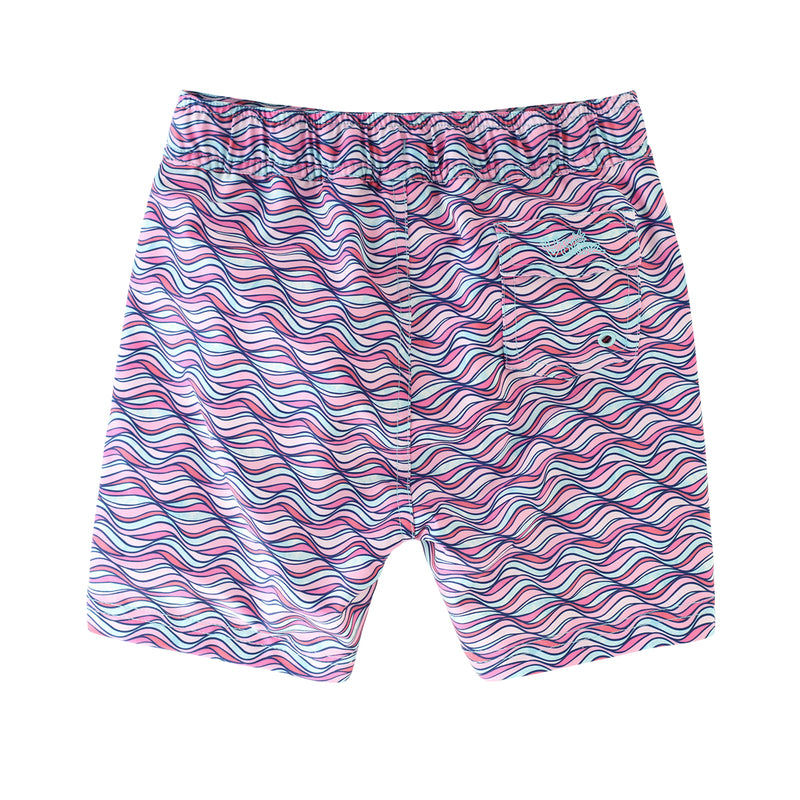 back view of the girl's board shorts in light pink waves|light-pink-waves
