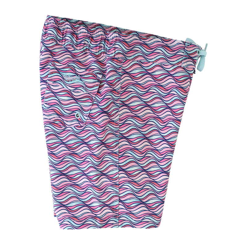 side view of the girl's board shorts in light pink waves|light-pink-waves