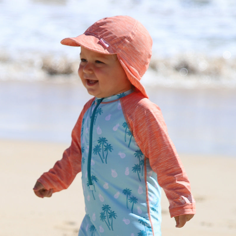 Boy in baby boy's swim flap hat in beach trees jaspe|beach-trees-jaspe