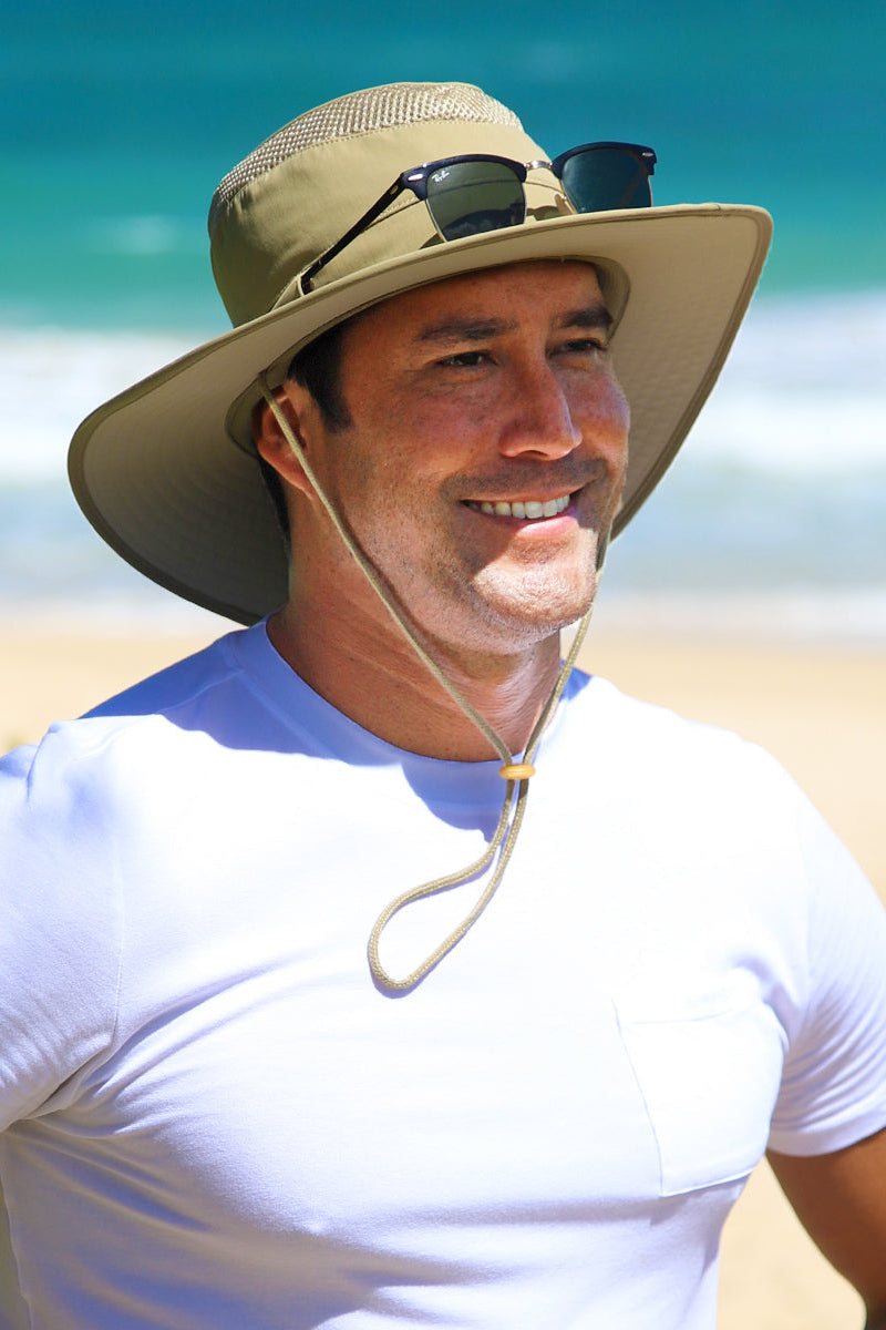 Man wearing UV Skinz's men's wide brim sun hat|khaki-mojave
